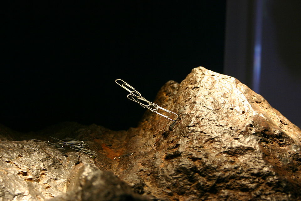 A Natural Magnet (Loadstone) attracting nails